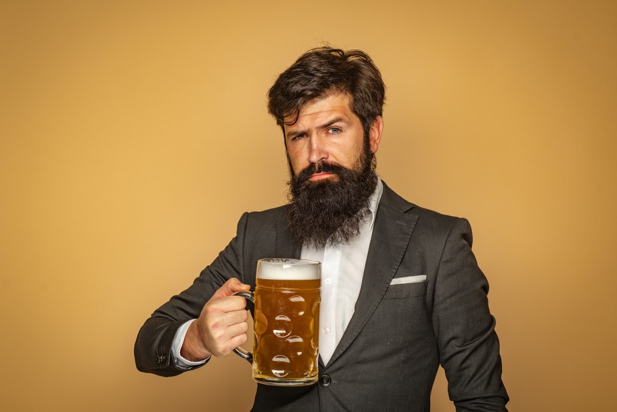 Man holding stein of beer